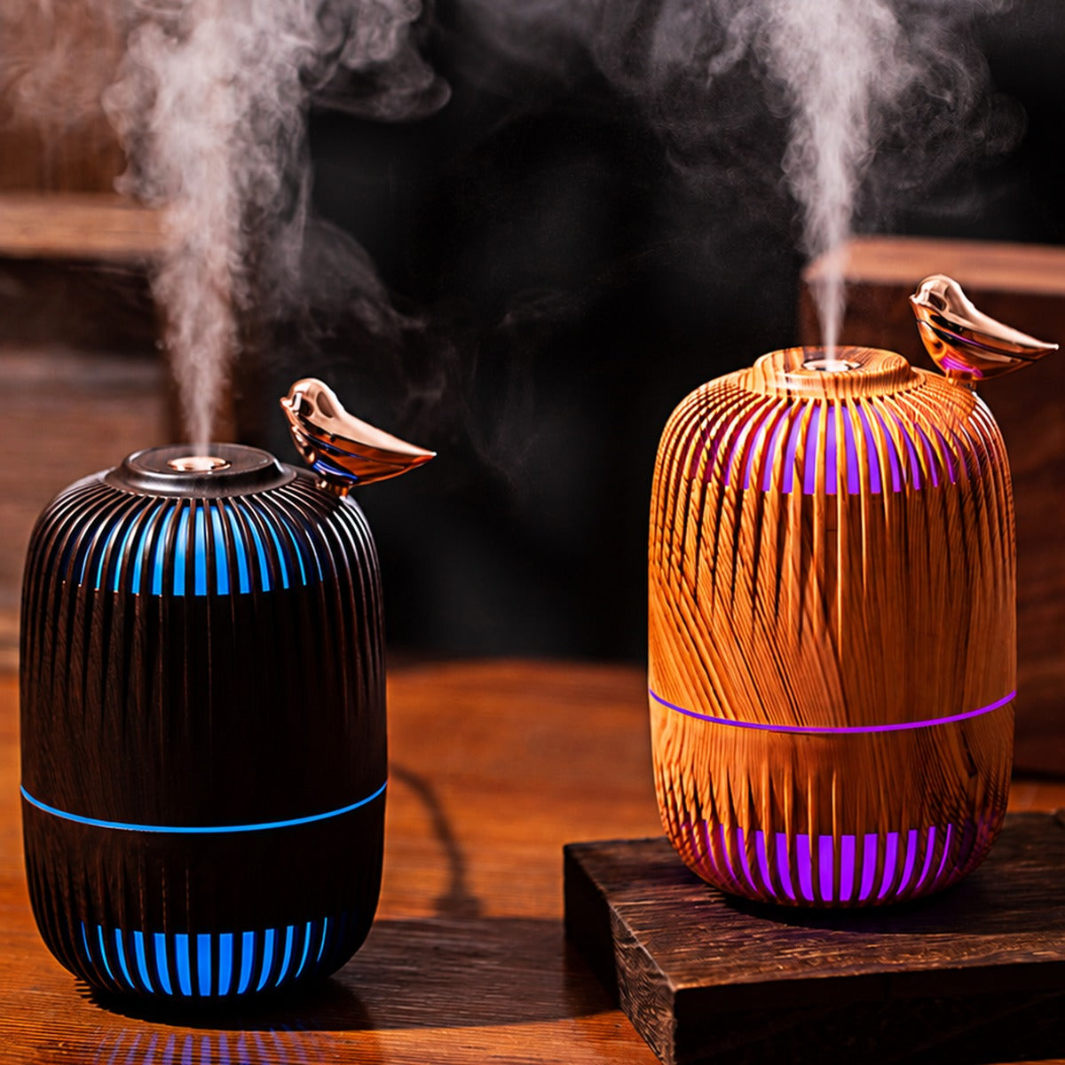 Dreambird Aroma Diffuser in Dark Walnut and Light Oak, misting with colored night light