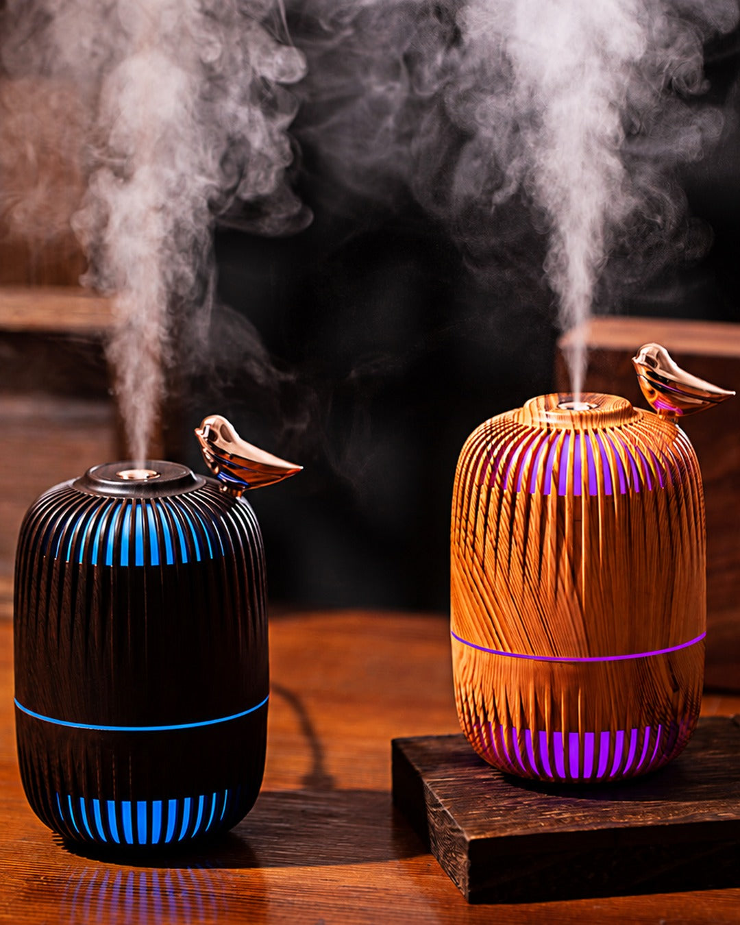 Dreambird Aroma Diffuser in Dark Walnut and Light Oak, misting with colored night light