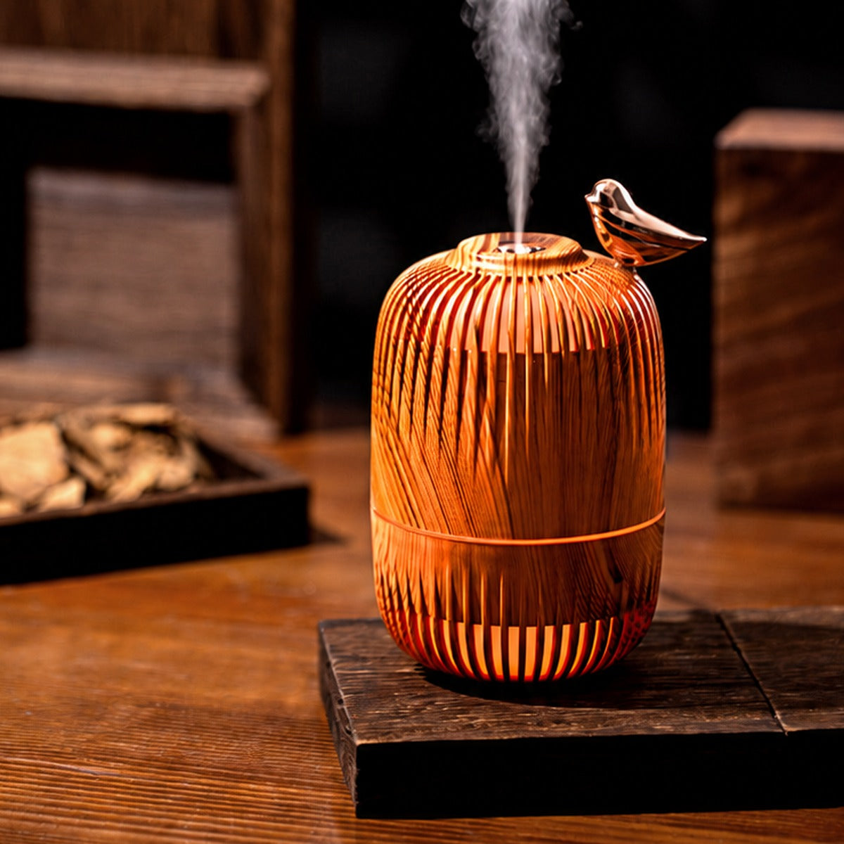Dreambird Aroma Diffuser in Light Oak releasing fine mist